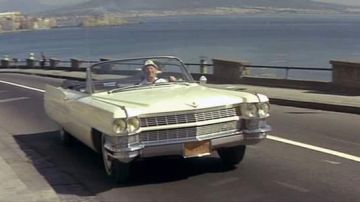 The Cadillac DeVille Convertible driving by Antoine Maréchal (Bourvil) in The Corniaud