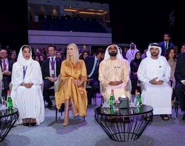 Jonathan Simkhai Flu­id Satin Mi­di Dress worn by Ivanka Trump Global Women’s Forum in Dubai February 16, 2020