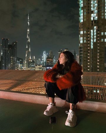 The jacket-orange, faux fur with long hair Eva Queen on the account Instagram of @iam_evaqueen