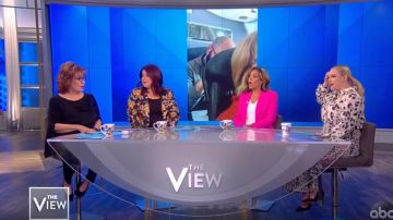 Vince camuto But­ton Split Sleeve Ham­mered Satin Top worn by Joy Behar on The View February 14, 2020