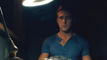 Blue henley t-shirt worn by The Driver (Ryan Gosling) as seen in Drive
