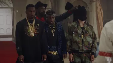 Handcuffs buckle belt in gold worn by Blink (Shameik Moore) in Cut Throat City