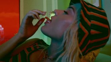 Striped black end red hat worn by Katy Perry in her Harleys In Hawaii music video