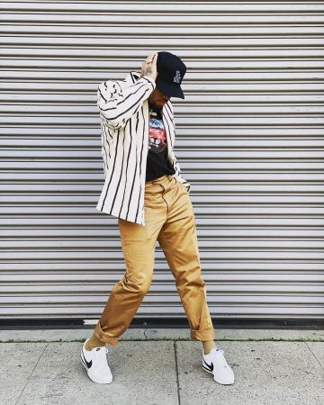 The white shirt with black stripes Chris Brown account on the Instagram of @chrisbrownofficial