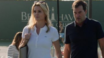 Lacoste White polo shirt worn by Megyn Kelly (Charlize Theron) as seen in Bombshell