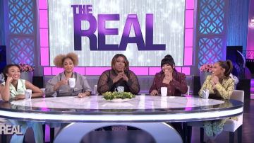 Pinko Snake­skin Ef­fect Blaz­er worn by Adrienne Bailon on The Real February 28, 2020