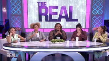 Pinko Snake­skin Print Trousers worn by Adrienne Bailon on The Real February 28, 2020