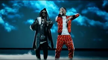 Balenciaga Over­sized Belt­ed Black Leather Coat of Lil Wayne in the music video Lil Baby Feat. Lil Wayne - Forever (Official Video)