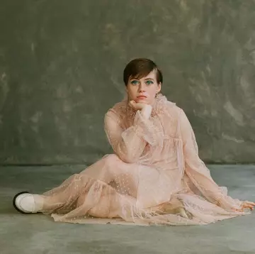 The dress long and a bit transparent, with white polka dots from Sophia Lillis on the account Instagram of @sophialillis