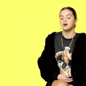 Free People Turn Up Black Faux Fur Hooded Jacket worn by Selena Gomez Genius Interview March 9, 2020