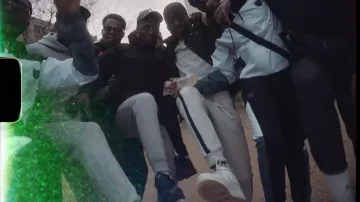 Sneakers white worn by one of the members of the L2B Gang in the clip Konoha #1