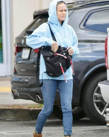 Prada Ny­lon Mes­sen­ger Bag with Stud­ding worn by Brie Larson Whole Foods March 17, 2020