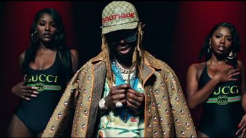 Gucci Met­al glass­es chain worn by Lil Wayne in the music video Lil Wayne - Mama Mia (Official Video)