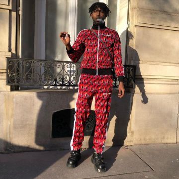 The tracksuit jacket red Palm Angels reach by Youv Dee on his account Instagram @youv_dee