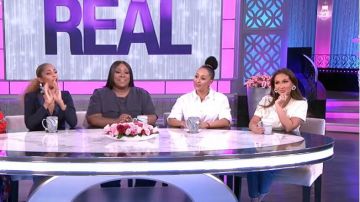 Sandro White Em­broi­dery T-shirt worn by Adrienne Bailon on The Real  March 24, 2020