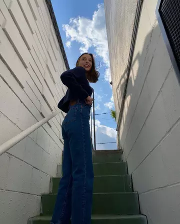 Retro And Groovy RL Flag Sweater of Emma Chamberlain on the Instagram account @_emmachamberlain March 30, 2020