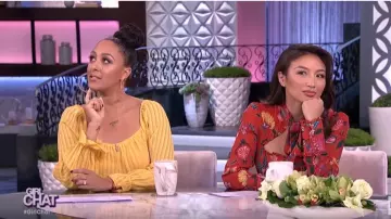 Alexis Imo­gene Flo­ral Jump­suit worn by Jeannie Mai on The Real March 31, 2020