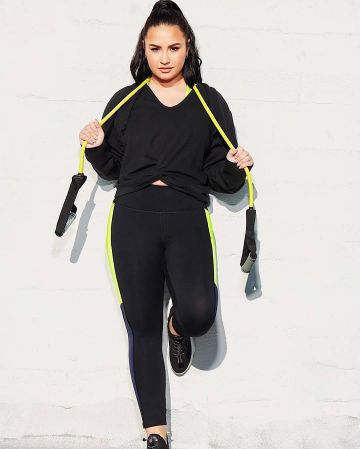 Fabletics Syd­ney Twist Front Hood­ie worn by Demi Lovato Fabletics