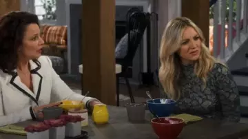 Flo­ral Turtle­neck Top worn by Rebecca (Abby Elliott) in Indebted Season 1 Episode 9