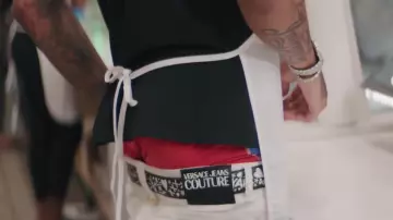 Versace Couture White pants worn by Blueface in his Holy Moly music video feat. NLE Choppa