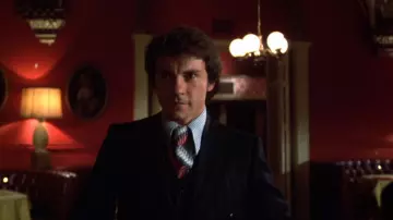 The three-piece suits with thin stripes worn by Charlie (Harvey Keitel) in Mean Streets.