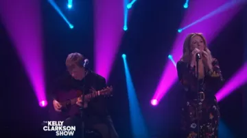 Stella mccartney Flo­ral Print Silk Crop Jump­suit worn by Rita Wilson on The Kelly Clarkson Show April 8, 2020