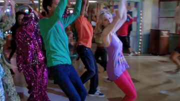 Pink-purple sparkly sequin dress worn by Shirley Bennett (Yvette Nicole Brown) in Community (S03E01)