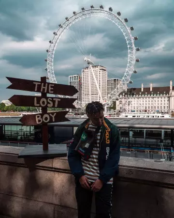 The jacket with tape logo navy blue Polo Sport worn by YBN Cordae on his account Instagram @ybncordae