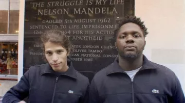 Lacoste zip jacket worn by Moha La Squale in his Rappelle-toi music video