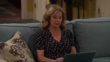 Flo­ral Wrap Blouse worn by Vanessa Baxter (Nancy Travis) in Last Man Standing Season 8 Episode 19