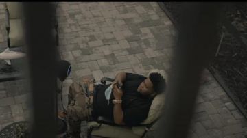 MCM Worldwide Mat­te Black Buck­le Brown Leather Belt worn by Rod Wave in his The Last Sad Song (Official Music Video)