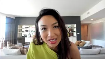 Nasty gal You Got­ta Be in It One Shoul­der Sweater worn by Jeannie Mai on The Real April 20, 2020
