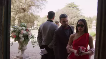 One shoulder red long dress worn by Amanda (Freida Pinto) in Love Wedding Repeat