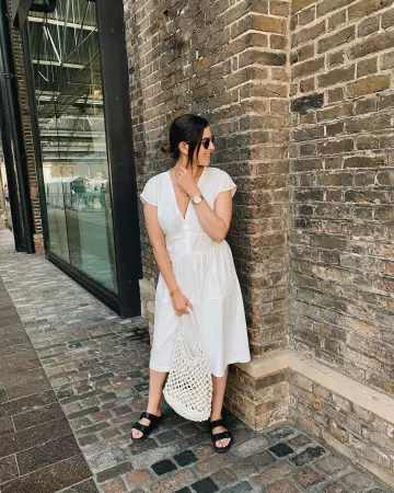 Birkenstock Black Flat San­dals of Lily Pebbles on the Instagram account @lilypebbles