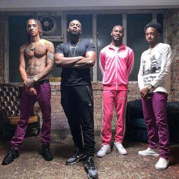 The pants pink tracksuit Palm Angels worn by David Omoregie on his account Instagram @santandave 