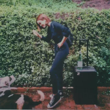 Con­verse Chuck Tay­lor All Star High Top sneakers worn by Zoey Deutch on her Instagram account @zoeydeutch