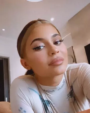 Marine Serre Tat­too Print Sheer Stretch Jer­sey top worn by Kylie Jenner Instagram Stories April 29, 2020