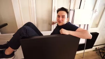 The blue pants with stripes worn by HugoPosay in his YouTube video BUILD A CABIN FOR THE CONTAINMENT with @FastGoodCuisine