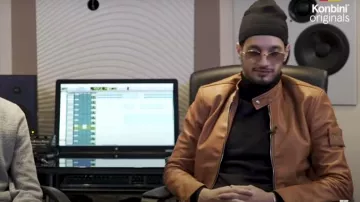 Le pull à col roulé noir de Soolking dans la vidéo Interview - Soolking : l'Algérie puis le monde ou rien