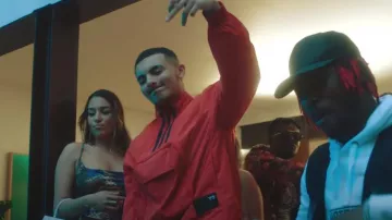 La veste de survêtement rouge orange Y-3 portée par RK dans le clip Prends ta monnaie de Bolémvn