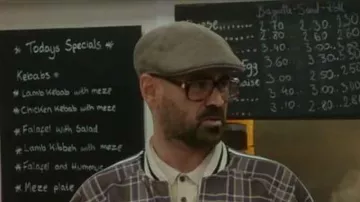 The cap in wool worn by Coach (Colin Farrell) in The Traveling