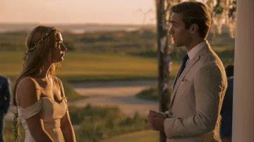 The dress naked shoulders worn by Sarah Cameron (Madelyn Cline) in the series Outer Banks (Season 1 Episode 5)