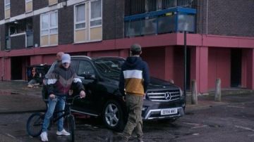 Color block zip jacket worn by an extra as seen in The Gentlemen