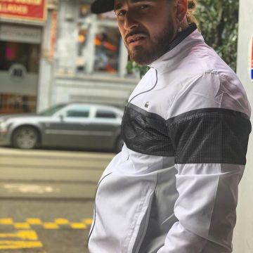 The jacket Lacoste worn by SCH on his account Instagram @sch 