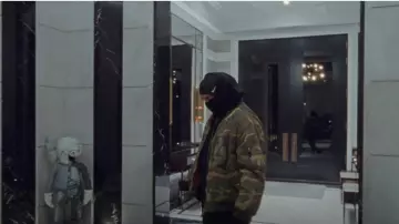 Raf Simons Camo Bomber Jack­et worn by Drake in Toosie Slide music video