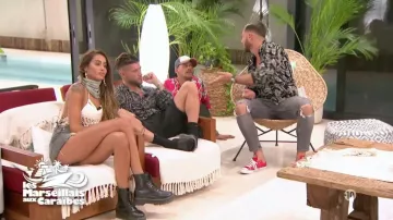 La paire de sneakers Converse rouges de Nacca dans Les Marseillais : Aux Caraïbes