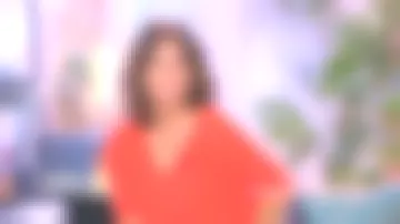 El suéter naranja de cuello en V de Faustine Bollaert en It Starts Today