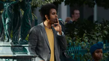 Blazer gris usado por Jude (Damián Nueva Cortés) en The Eddy (S01E04)