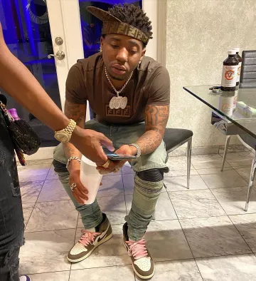 Amiri Mo­to skin­ny-fit Jeans worn by YFN Lucci on his Instagram account @yfnlucci