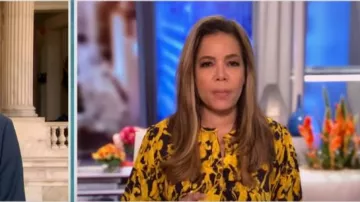 Stine goya Mus­tard Ren print­ed jacquard blouse worn by Sunny Hostin on The View May 21, 2020